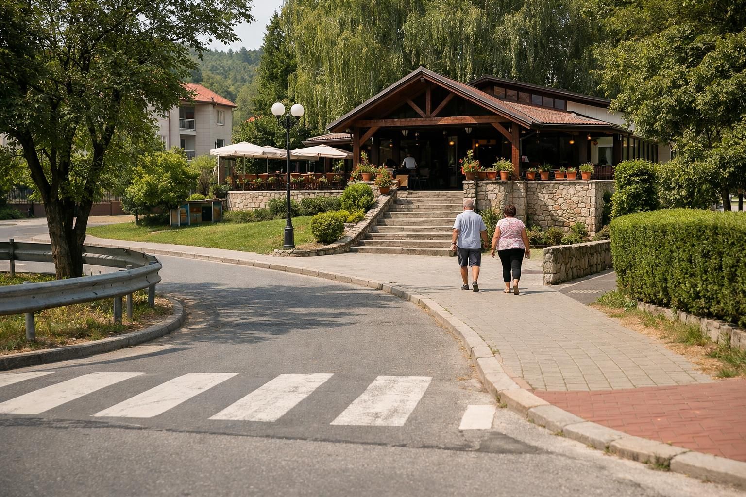 Couple walking toward restaurant terrace with umbrellas and flowers